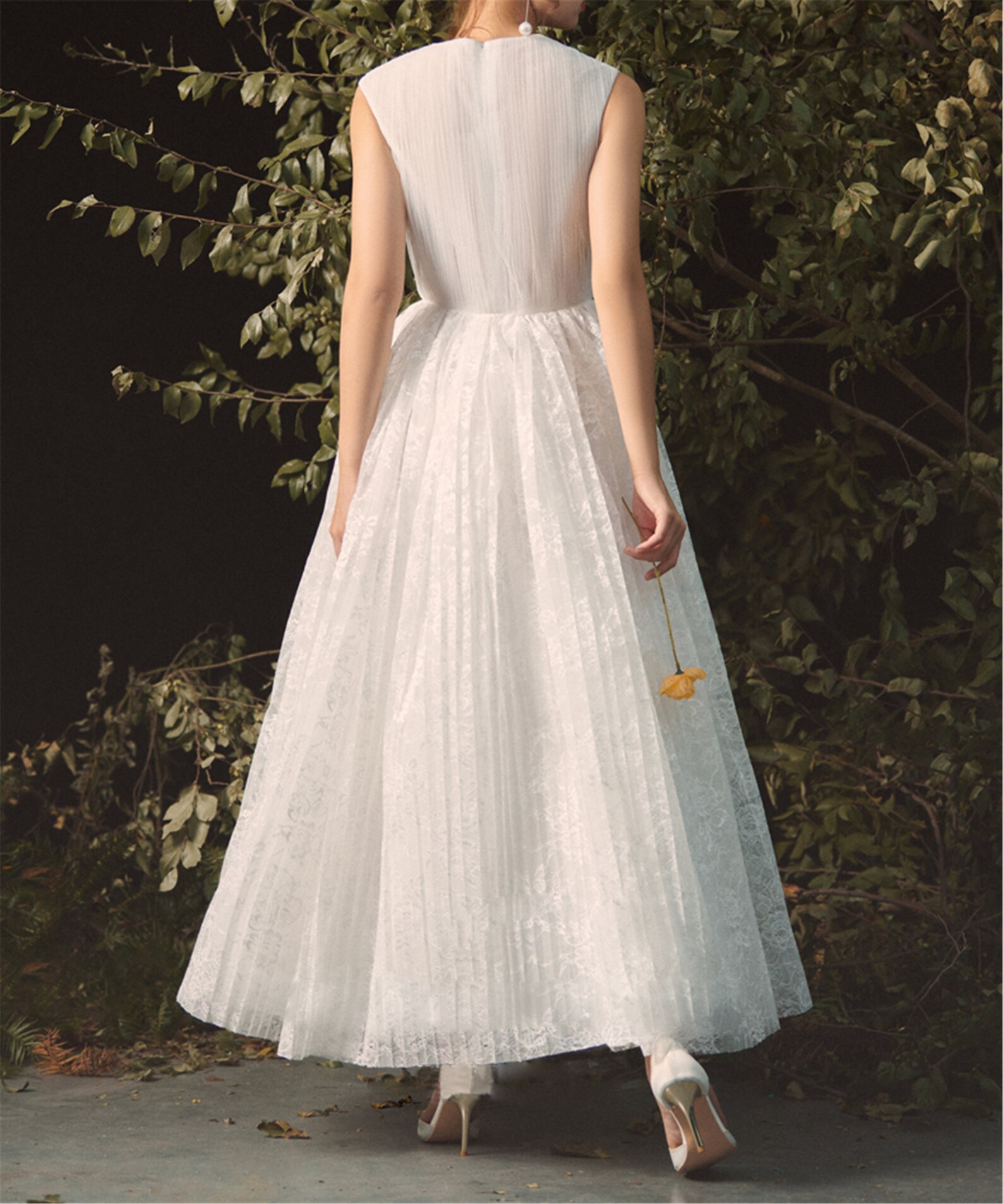 Ivory A-Line Wedding Dress with Deep V-Neck – Sleeveless & Backless Bridal Gown