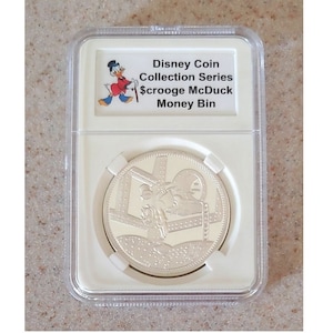 Disney Medallion Coin Collective Series Scrooge McDuck Series Style #2 of 5 Money Bin LE150 displayed and protected in a beautiful coin slab