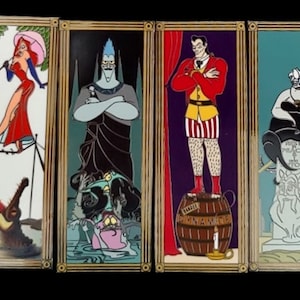 May include: Four framed Disney villain character pins. The pins are in a row from left to right. The first pin features Jessica Rabbit in a red dress, standing on a tightrope with a crocodile below. The second pin features Hades from Hercules, standing with his arms crossed. The third pin features Prince John from Robin Hood, standing on a barrel with a lit candle. The fourth pin features Ursula from The Little Mermaid, sitting on a tombstone with a crab below.