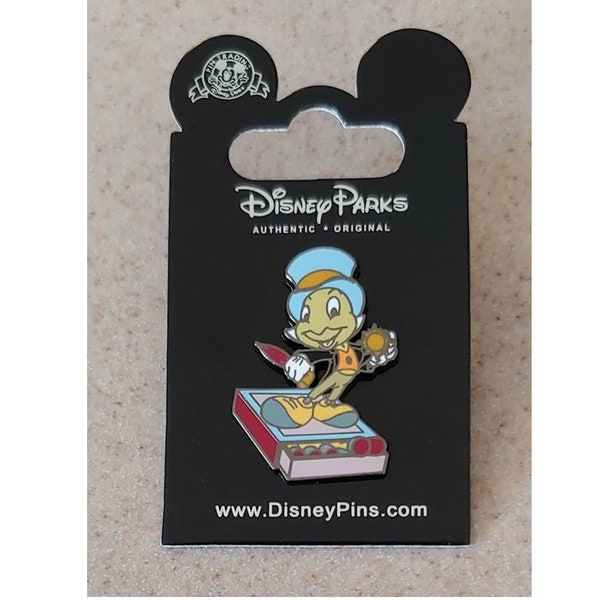 Disney Pin - Pinocchio - Jiminy Cricket standing on Match Box with Conscience Badge