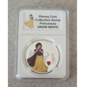 Disney Collective Medallion Coin Jeweled Heart Princesses - Snow White & Castle LE150 displayed and protected in a beautiful coin slab