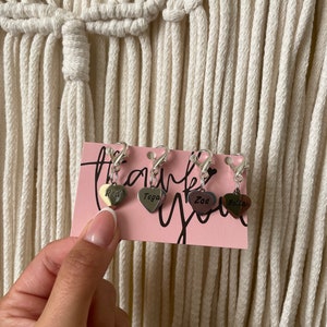 Set of personalized engraved charms displayed on thank-you card, each with different horse names.