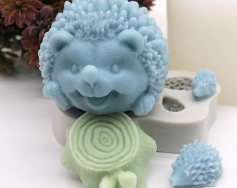 May include: A set of three blue silicone molds for making hedgehog and tree stump shapes. The molds are made of flexible silicone and are easy to use.