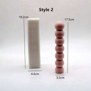 May include: Two candle molds, one is a rectangular shape measuring 18.2 inches tall and 4.4 inches wide, the other is a stack of 7 round shapes measuring 17.5 inches tall and 3.2 inches wide.