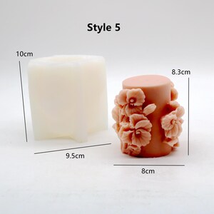 May include: Two silicone candle moulds, one is a plain cylinder mould measuring 8 cm in diameter and 8.3 cm in height, the other is a square mould measuring 9.5 cm wide and 10 cm tall. Style 5.