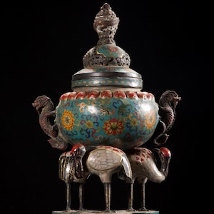 May include: A white ceramic mug with a black handle and the text "But First, Coffee" in a bold, black font. The mug is set against a neutral background, highlighting its simple design.