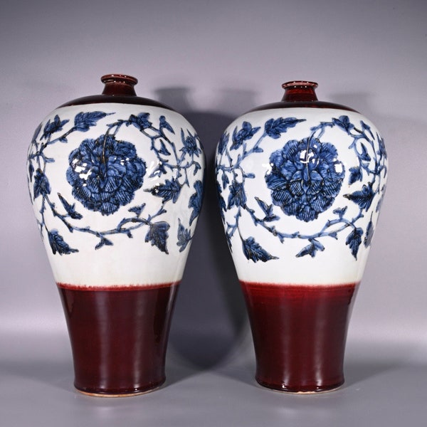 A pair of exquisite and rare Chinese antique hand-painted red glaze white blue and white peony pattern plum vase ornaments