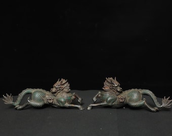 A pair of exquisitely handcrafted pure bronze Qilin statues, antique Chinese style.