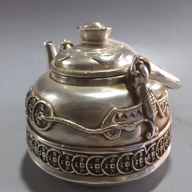 The silver teapot statue of ancient Tibet in China is made of Etsy