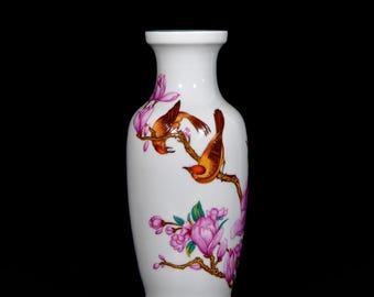 Exquisite Chinese antique enamel vase with floral and bird motifs, hand-painted.