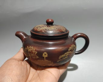 Exquisite Chinese antique clay-painted lotus-patterned teapot, a Zisha teapot ornament.