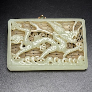 Exquisite and rare flying dragon pendant hand-carved from Chinese white jade