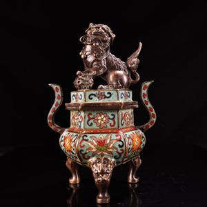 A rare and exquisite handcrafted Chinese antique copper high relief cloisonné enamel incense burner with a lion lid and animal feet