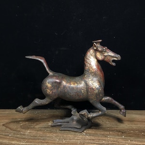 A rare and exquisite handcrafted Chinese antique bronze horse stepping on a flying swallow statue