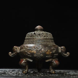 A rare and exquisite handcrafted Chinese antique copper elephant incense burner with two handles