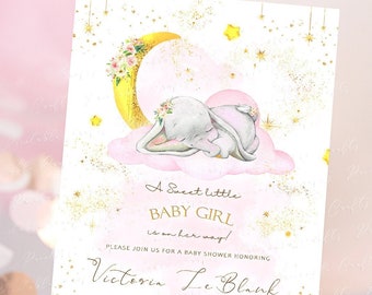 May include: A baby shower invitation with a pink and gold color scheme. The invitation features a watercolor illustration of a baby elephant sleeping on a cloud with a crescent moon and stars in the background. The text on the invitation reads "A Sweet Little Baby Girl is on her way!" and includes the baby's name, the date and time of the shower, and the address. The invitation also includes the text "Registry Amazon & Target".
