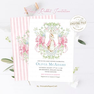 May include: A pink and white striped background with a white card featuring a watercolour illustration of a rabbit wearing a pink dress and a bow. The card is for a baby shower celebrating Olivia McAdams. The text on the card reads "Join us for a baby shower celebrating Olivia McAdams, Saturday August 17th at 2-5 PM, 205 Residence, England CO4 OLR, United Kingdom, RSVP to Olivia at 1023456789, Registered at Amazon & Target, By- PrintablePaperCraft."