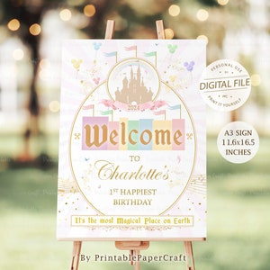 May include: A printable sign for a 1st birthday party with a pink, blue, and yellow color scheme. The sign features a castle, a rainbow, and the text "Welcome to Charlotte's 1st Happiest Birthday. It's the most magical place on Earth." The sign is 11.6 inches by 16.5 inches.