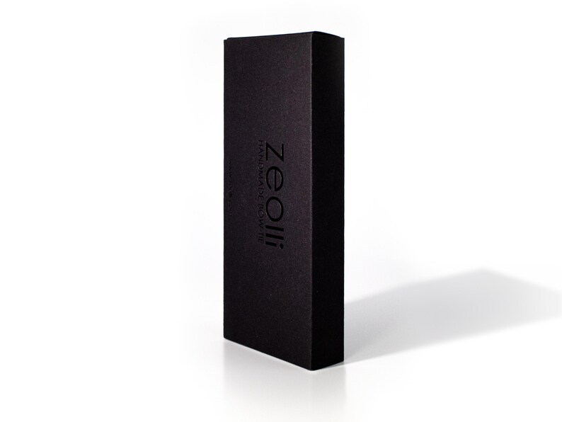 May include: A black box with the text "Zeolli" and "Handmade & Sustainably" printed on it.