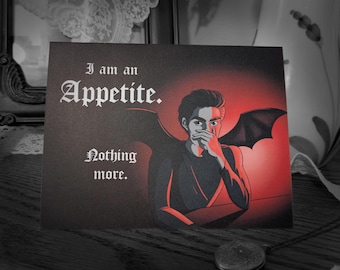 May include: A black and red card with a dark-haired person with wings. The text on the card reads "I am an Appetite. Nothing more."
