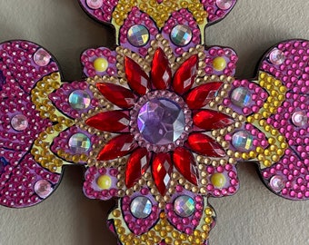 This beautiful cross is  stunning! The photos do not do it justice. When the light hits  this cross it looks like diamonds.
