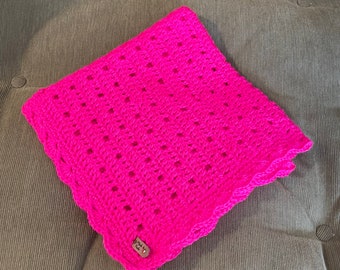 Neon pink crocheted baby blanket