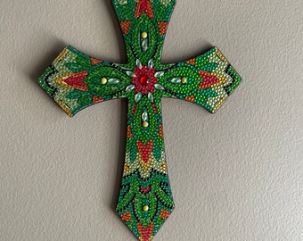 Think green! This cross is several shades of green. It is beautiful. When  the light hits it looks like diamonds!