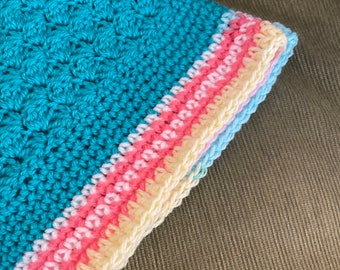 Beautiful crochet teal baby blanket with “candy” colored border