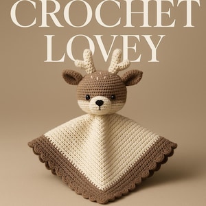 May include: A crocheted deer lovey. The deer has a brown head, ears, and antlers, with a cream-coloured face and blanket. The blanket has a brown border with a scalloped edge. The text "CROCHET LOVEY" is at the top.