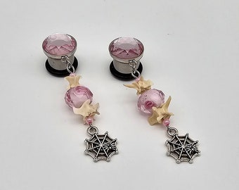 Pink snake vertebrae plug earrings