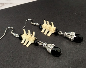 Black glass teardrop and snake bone earrings