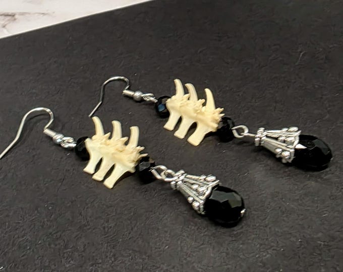 Black glass teardrop and snake bone earrings