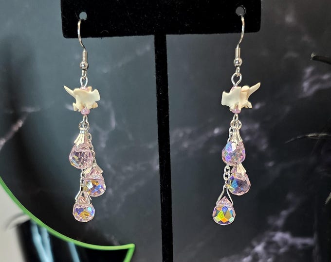 Pink glass teardrop and rattlesnake vertebrae earrings