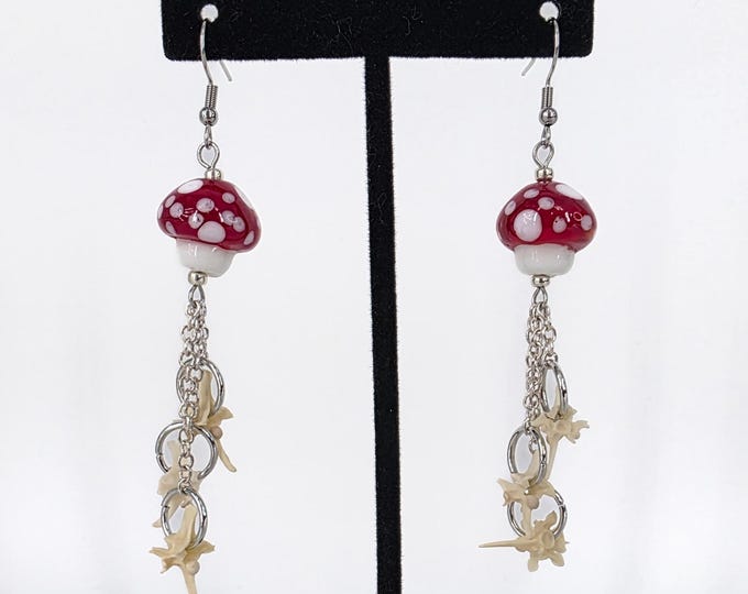 Red mushroom and rattlesnake vertebrae dangle earrings