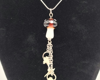 Brown mushroom and rattlesnake vertebrae dangle necklace