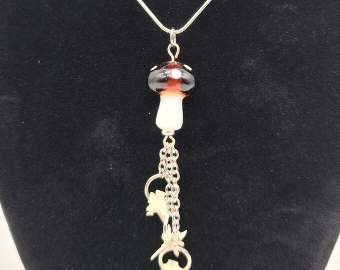 Brown mushroom and rattlesnake vertebrae dangle necklace