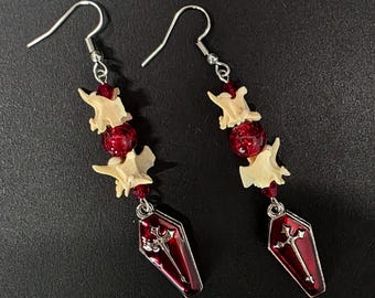 Red coffin and rattlesnake vertebrae earrings