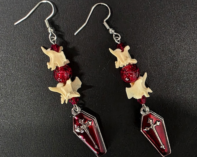 Red coffin and rattlesnake vertebrae earrings