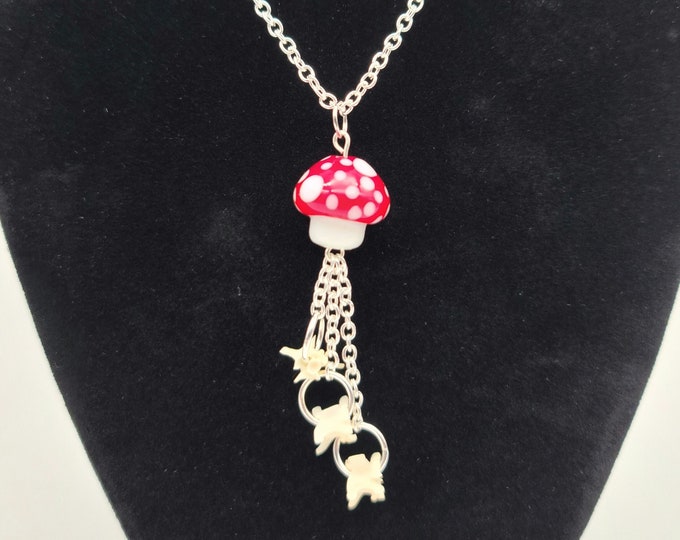 Red mushroom and snake vertebrae dangle necklace