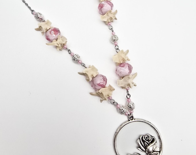 Pink rose and rattlesnake vertebrae necklace