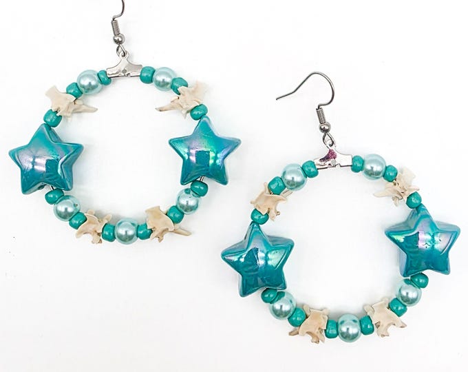 Teal star and rattlesnake vertebrae hoop earrings