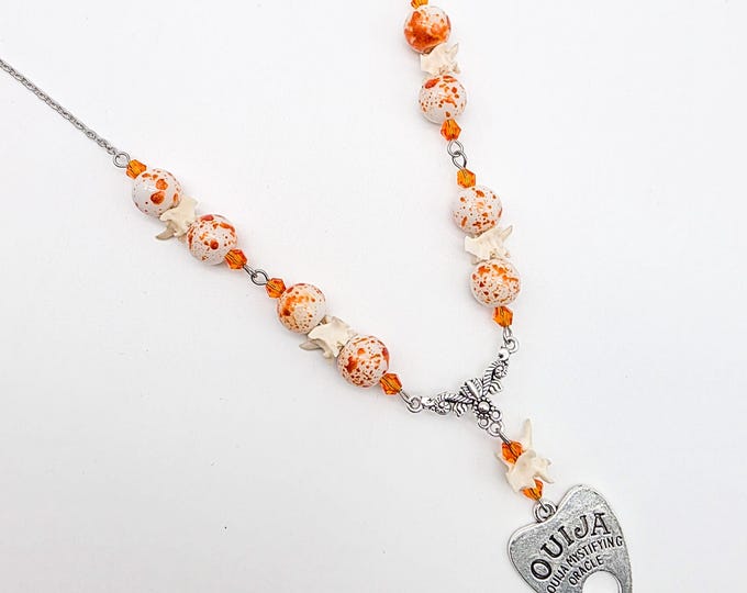 Orange planchette rattlesnake vertebrae necklace
