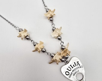 Planchette and snake vertebrae necklace