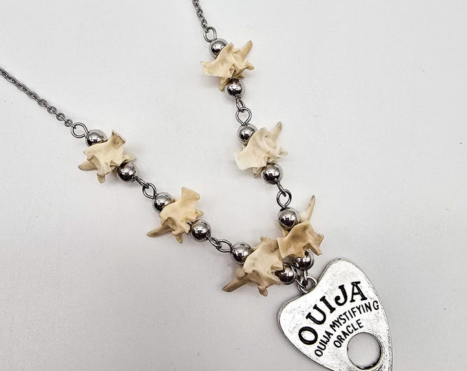 Planchette and snake vertebrae necklace