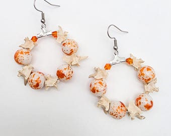 Orange rattlesnake vertebrae hoop earrings