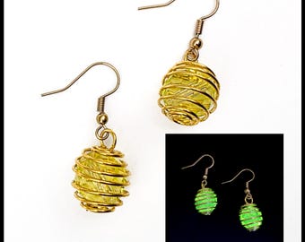 Gold bead cage uranium glass earrings