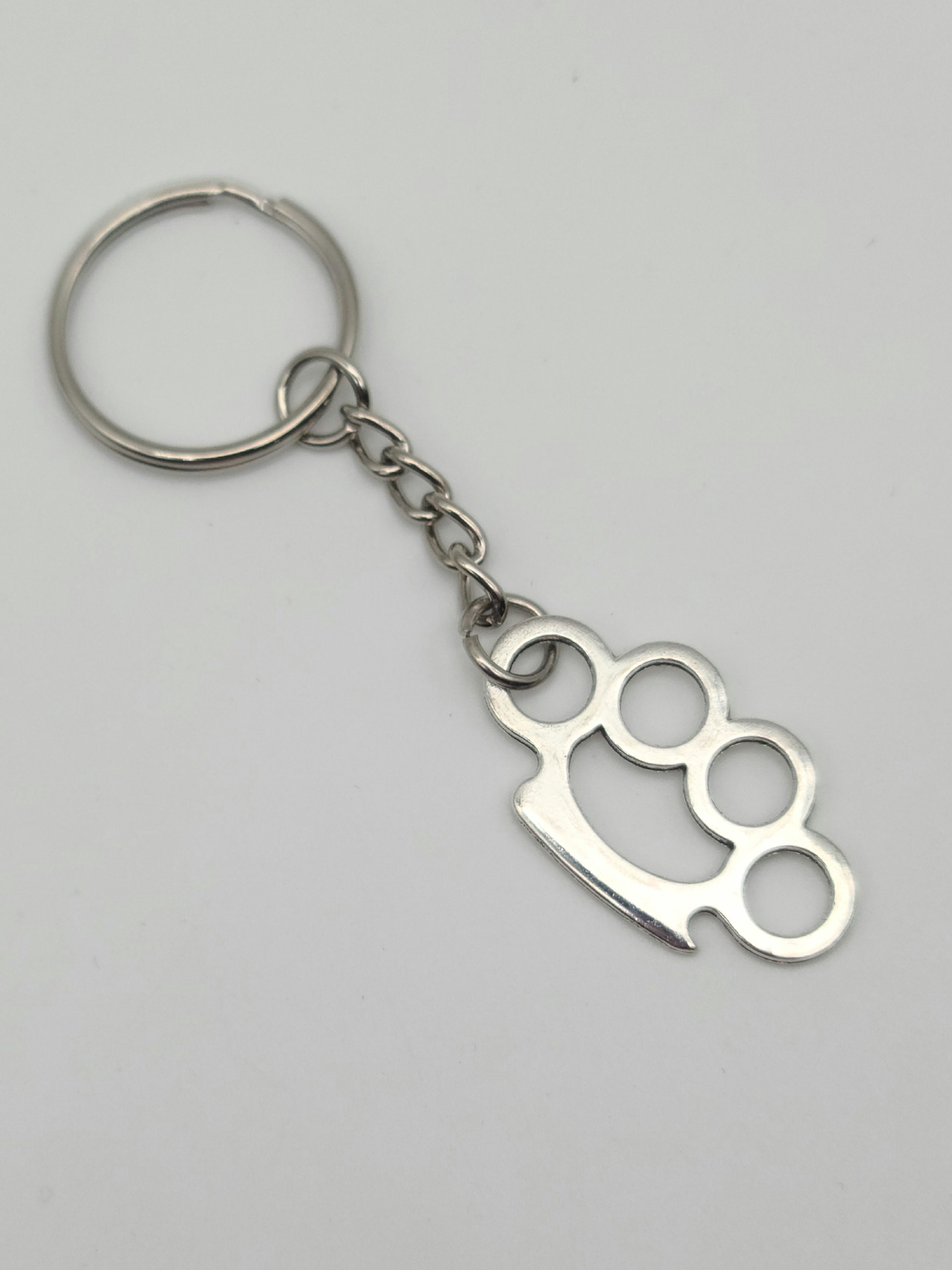 TiraPugni portachiavi Brass Knuckles pendaglio nocccoliere in alluminio