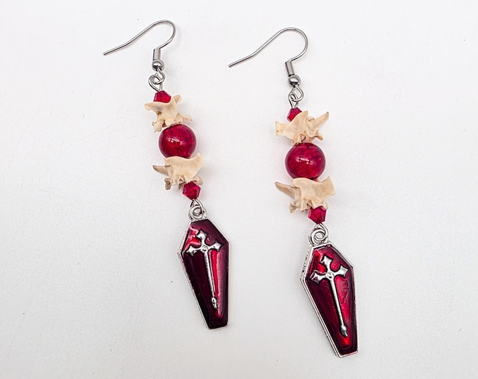 Red coffin and rattlesnake vertebrae earrings