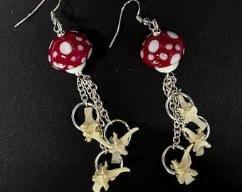 Red mushroom and rattlesnake vertebrae dangle earrings