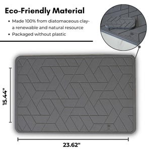 May include: Grey rectangular kitchen mat made from diatomaceous clay. The mat measures 39.2 cm by 60 cm and features a geometric pattern. The mat is made from a renewable and natural resource and is packaged without plastic.